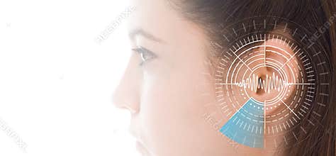 Hearing test showing ear of young woman with sound waves simulation technology