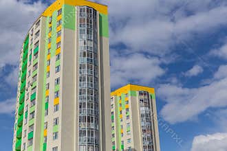 Apartment building.Multistoried modern and stylish living block of flats. Real estate. New house. Real Estate.