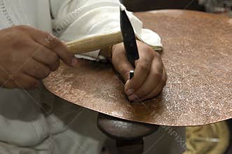 Copper smith at work