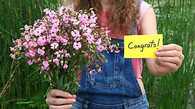 Congrats - beautiful woman with card and flowers