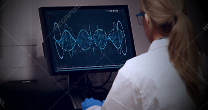 Doctor looking dna molecule on computer