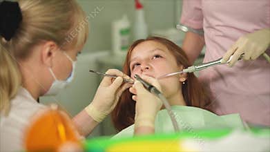 A dentist who did a tooth brushing in a teenager in a dental clinic