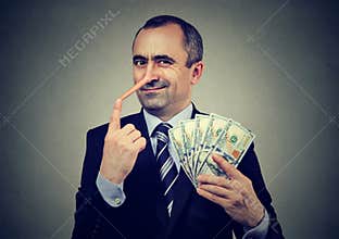 Financial fraud concept. Liar businessman executive with dollar cash