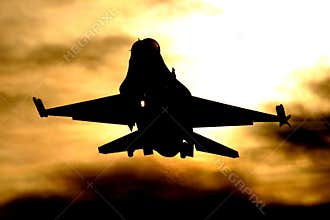 F-16 landing at sunset