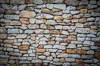 Stone wall background with vignetted borders