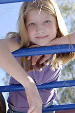 Girl on monkey bars