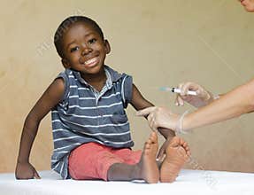 Full body shot of a happy African black child getting a needle injection as a medical vaccination