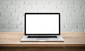 Modern computer,laptop with blank screen on wall brick