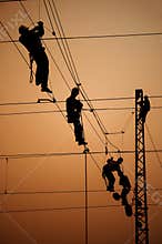 Electricians repair contact wire