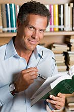 Mature man reading book