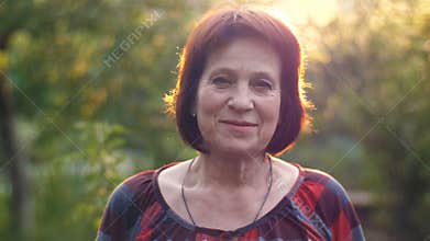 Portrait of smiling aged woman