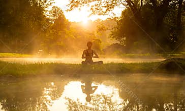 Healthy woman lifestyle exercising vital meditate and energy yoga in morning the spring nature background.