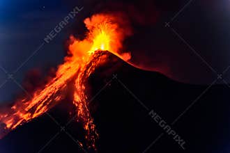 Lava spurts from erupting Fuego volcano in Guatemala