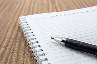 notepad with pen lying