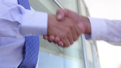 Close Up Of Two Businessmen Shaking Hands