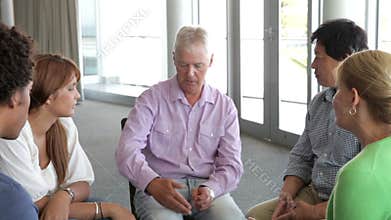 People Having Discussion In Support Group
