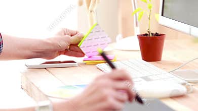 Casual designer working at her desk