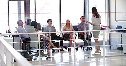 People Attending Business Meeting In Modern Open Plan Office