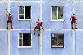 A team of industrial climbers working