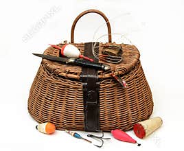 Fly fishing equipment and basket on white