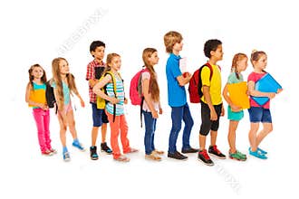 Many happy kids in a line to school