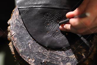 Punch leather shoes.