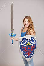 Teen girl with cosplay sword and shield