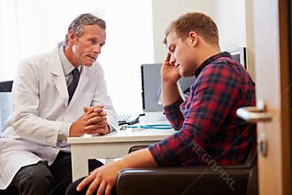 Doctor Treating Male Patient Suffering With Depression