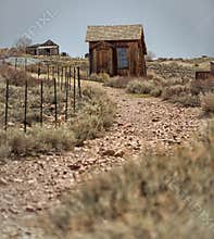 Wood huts on dirt road