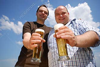 Two men holding beer