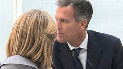 Leadership working with colleague