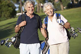 Senior Couple Enjoying Game Of Golf