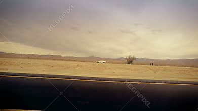 Traveling Through Dramatic Desert From Car