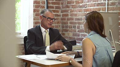 Woman Meeting With Financial Advisor In Office