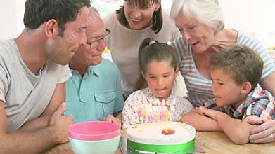 Multi Generation Family Celebrating Daughter's Birthday