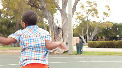 Multi Generation Family Playing Basketball