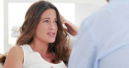 Concerned therapist talking with a pregnant woman