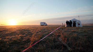 Ambulance rides in the background