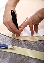 Hands notch tailor fabric.