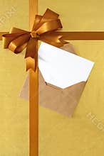 Christmas or birthday card vertical gold gift ribbon bow