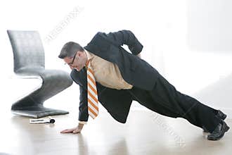Business man Does One Armed Pushup