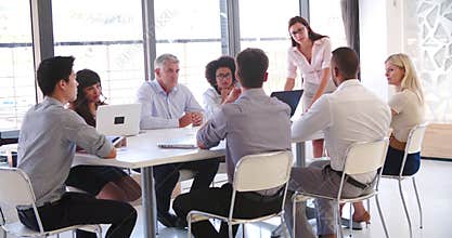 People Attending Business Meeting In Modern Open Plan Office