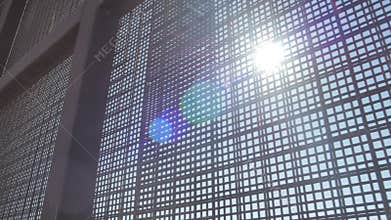 Sun Shines Through Fence on US and Mexico Border