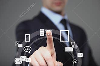 Business, technology, internet and networking concept - businessman pressing button with contact on virtual screens.