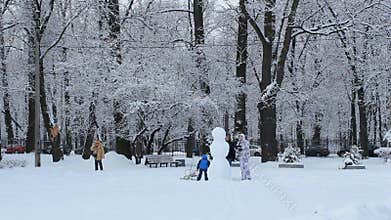 Snowman in a winter park.