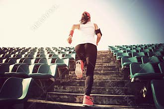 Athlete running on stairs. woman fitness jogging workout wellness concept.