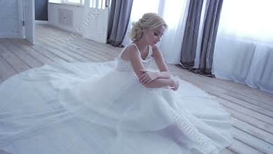 Beautiful bride posing in her wedding dress