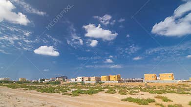 Cityscape of Ajman with villas ready and under constroction timelapse. Ajman is the capital of the emirate of Ajman in