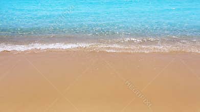 Perfect beach with sailboat in turquoise aqua color and the waves