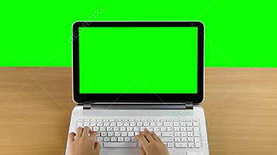 Typing on a laptop computer.